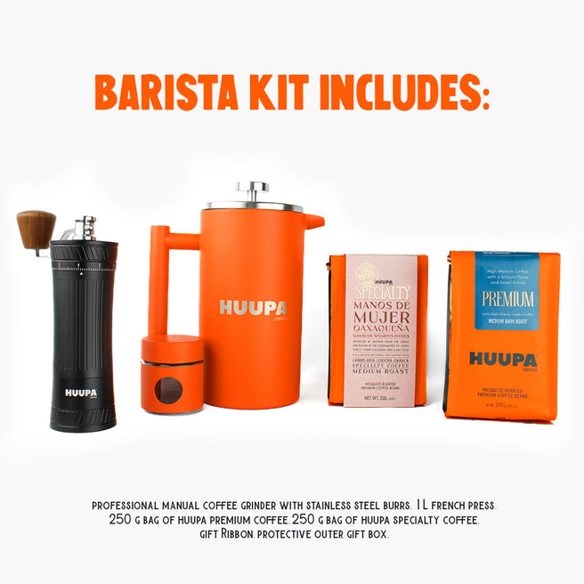 Barista kit with coffee grinder, French press, and coffee bags on a white background