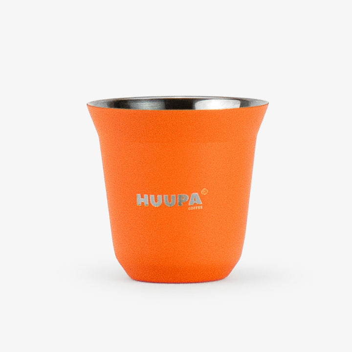 An orange insulated espresso cup with a stainless steel interior and the brand name 'HUUPA coffee' printed in silver on the front, set against a plain light gray background.