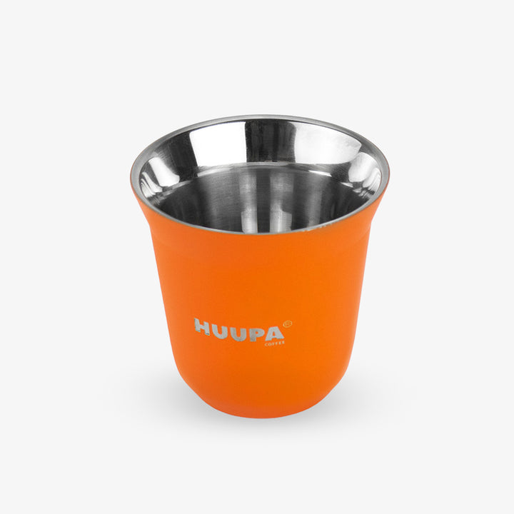An orange insulated espresso cup with a stainless steel interior, featuring the HUUPA logo printed in gray on the front, set against a light gray background.