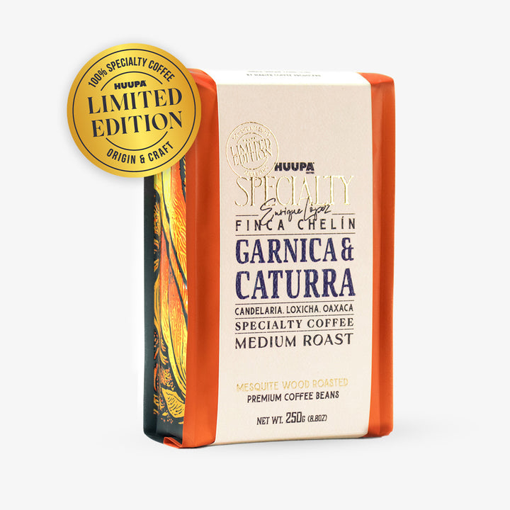 A package of Huupa Specialty Coffee Garnica & Caturra Medium Roast coffee beans, featuring a cream-colored label with dark blue text, orange side borders, and a gold 'Limited Edition' sticker on the top left, set against a plain white background.