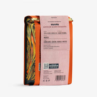 Huupa Specialty Coffee bag with orange and pink design on a white background