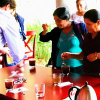 Women trying coffee in collaboration with Enrique Lopez