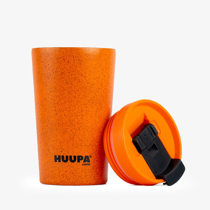 Orange tumbler on a white background, featuring the Huupa brand.